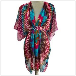 Fantastic BeBe Sheer CoverUp. Beautiful, vibrant colors. Size XS.